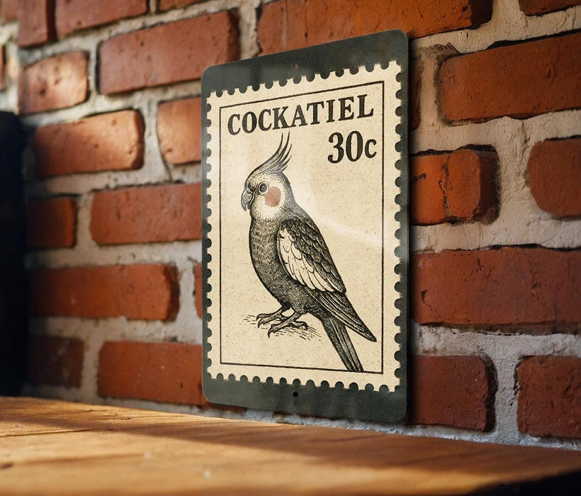 A vintage-style postage stamp featuring a detailed illustration of a cockatoo, with the text "COCKATIEL 30c" printed on it. The stamp is mounted on a brick wall, and there is a wooden table below it.