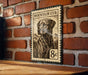 A metal sign with a dog illustration and the text "MOUNTAIN CUR" is mounted on a brick wall.