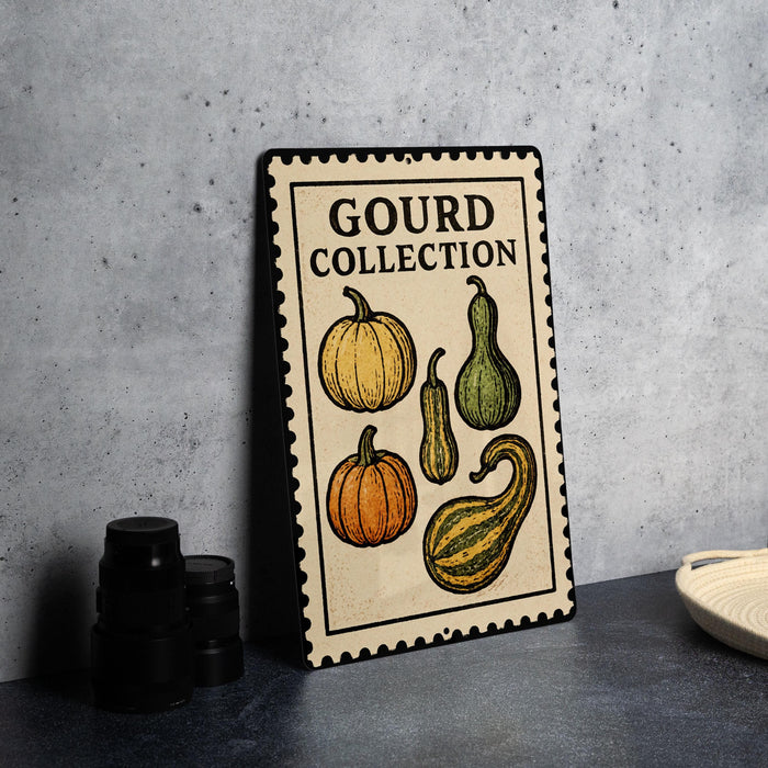 A metal sign with a decorative border and illustrations of gourds and pumpkins, labeled as a "Gourd Collection".