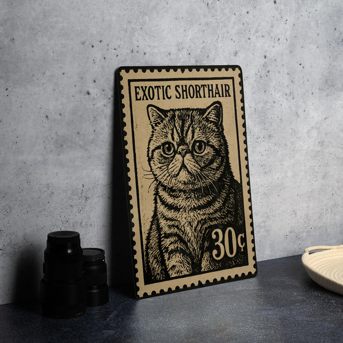 A metal stamp featuring an illustration of a cat, with the text "Exotic Shorthair" and the number "30¢" printed on it.