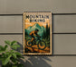 A vintage-style metal sign with a mountain biker illustration, mounted on a wall next to a plant.