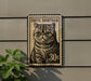a cat, specifically an exotic short haired cat, on a postage stamp-like sign.