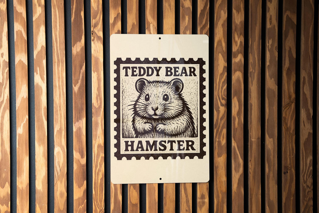 A metal sign with a teddy bear image and the text "Teddy Bear Hamster" is mounted on a wooden wall.