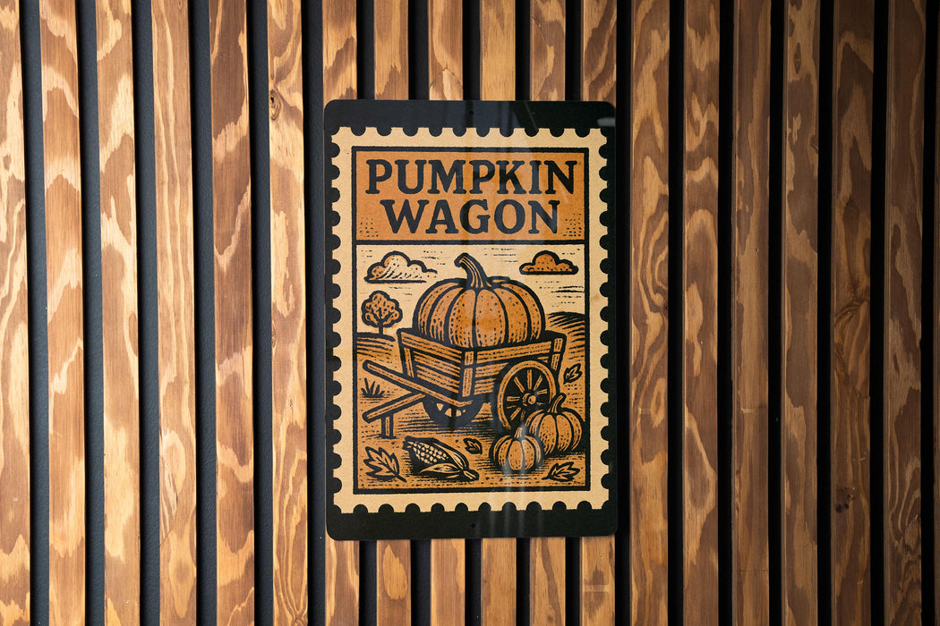 A sign with the text "PUMPKIN WAGON" and an illustration of a pumpkin and wagon is displayed on a wooden wall.