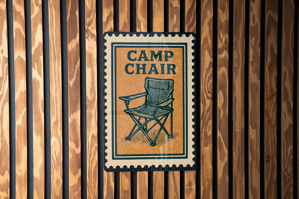 A sign with the word "CAMP CHAIR" on it is displayed on a wooden wall.