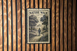 A vintage-style postage stamp featuring a person walking on a path through a wooded area, with the text "NATURE WALK" prominently displayed.
