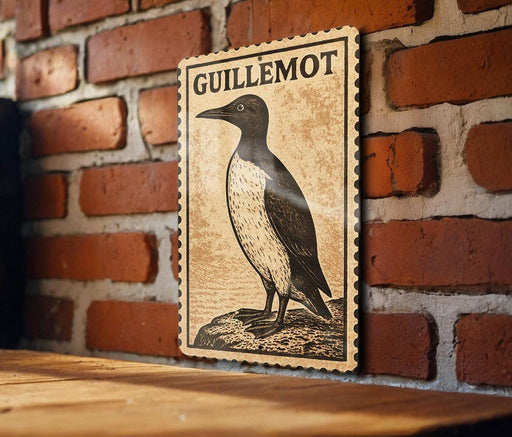 a wooden frame with a printed illustration of a bird, likely a penguin, on a brick wall.