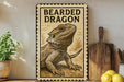 A framed image of a bearded dragon is displayed on a shelf, accompanied by a wooden cutting board and a potted plant.
