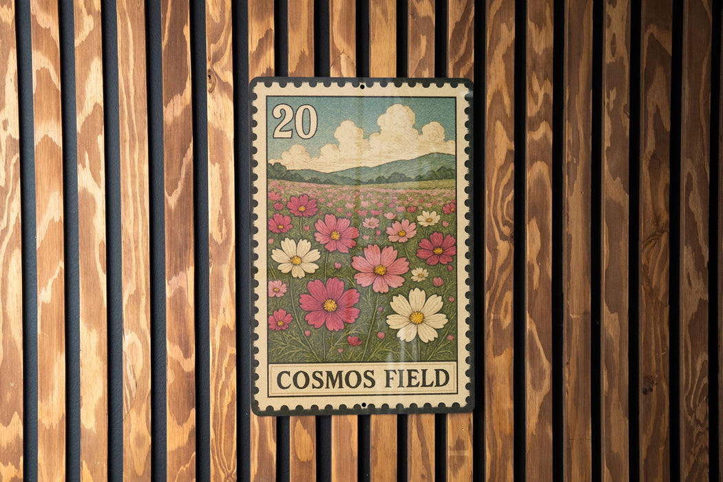A vintage-style postage stamp depicting a field of colorful flowers, with the text "COSMOS FIELD" printed on it.