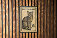 A postage stamp featuring an illustration of a spotted cat, with the text "EGYPTIAN MAU" and the value "15c".