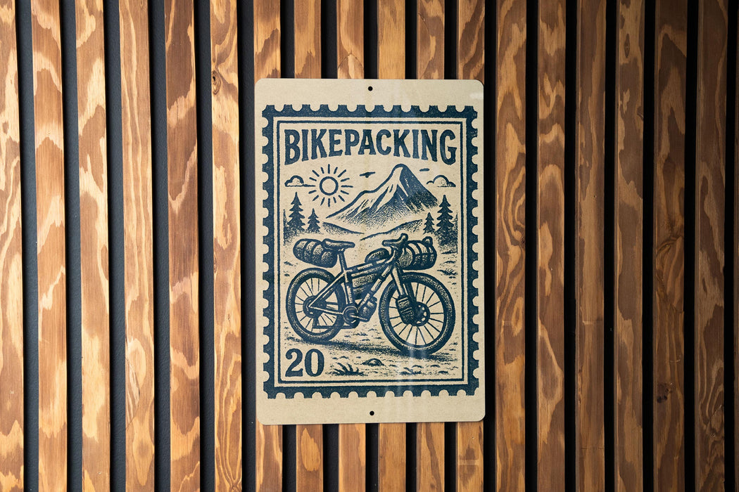 a bicycle with a basket, mounted on a wooden wall.