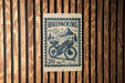 a bicycle with a basket, mounted on a wooden wall.