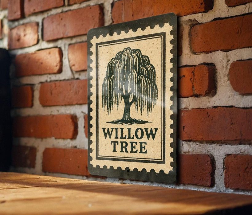a sign with the text "WILLOW TREES" and a graphic of a willow tree. The sign is mounted on a brick wall, and there is a wooden table below it.