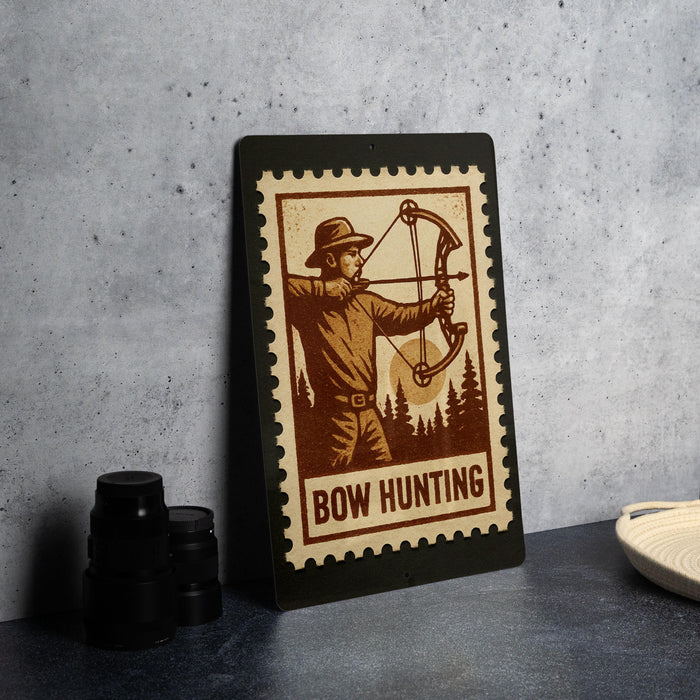 A framed image of a man holding a bow and arrow, with the text "BOW HUNTING" printed on the frame.