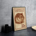 A metal stamp featuring a hamster on it, with the text "CAMPBELL'S DWARF HAMSTER" and the value "25c".
