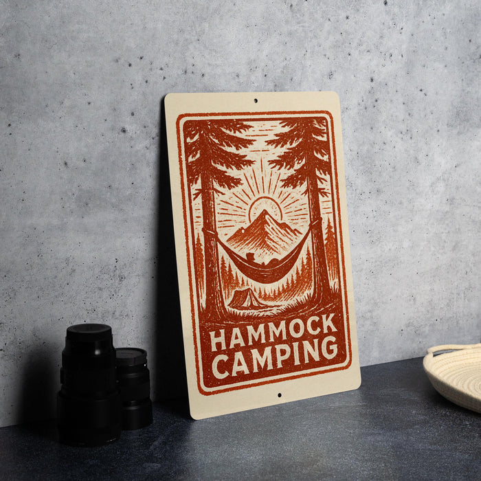 a sign with a hammock and camping scene, along with the text "HAMMOCK CAMPING" prominently displayed.