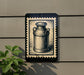 a black and white illustration of a milk can mounted on a wall, with a plant to the left of the frame.