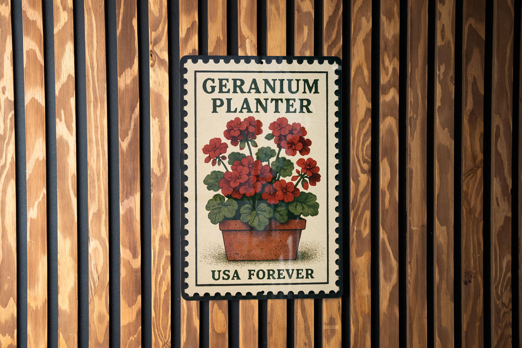 A vintage-style postage stamp featuring a potted geranium plant, mounted on a wooden wall.