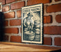 A sign with the title "Cheese Making" is displayed on a brick wall, featuring an illustration of a person making cheese.