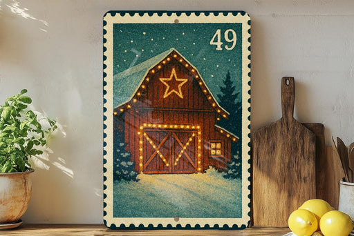 A framed illustration of a wooden barn with a star on the roof, surrounded by a snowy landscape, is displayed on a wall.