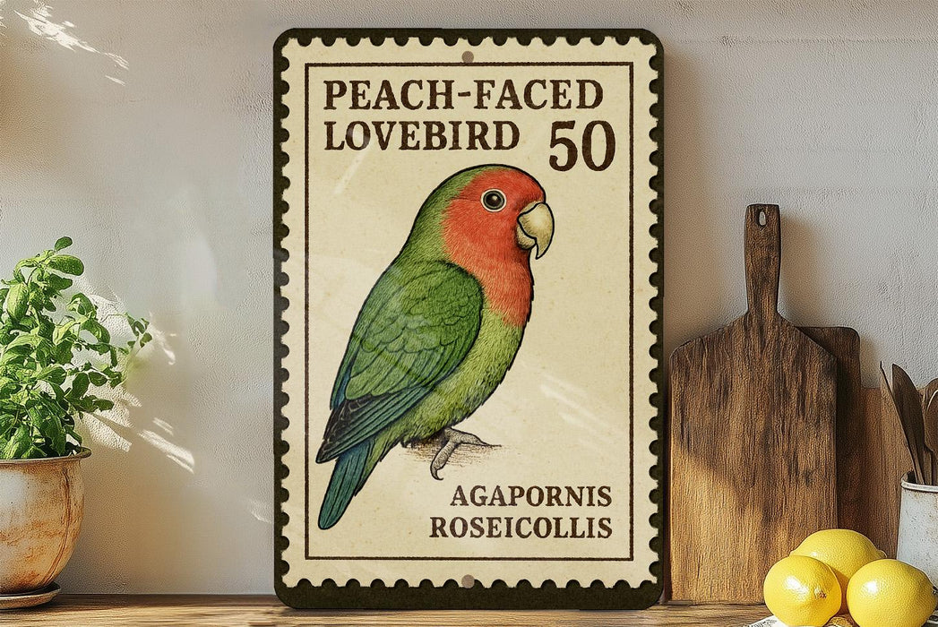 A vintage postage stamp featuring a peach-faced lovebird, with the text "PEACH-FACED LOVEBIRD 50" and "AGAPORNIS ROSECOLLIS" printed on it. The stamp is displayed on a wooden shelf, with a potted plant, a cutting board, and some lemons nearby.