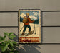 A vintage-style postage stamp depicting a person skiing on snowshoes, with the word "SNOWSHOEOING" written below the illustration.