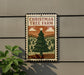 A Christmas tree farm sign is displayed on a wall, featuring a large illustration of a Christmas tree surrounded by pine trees and a cloudy sky.