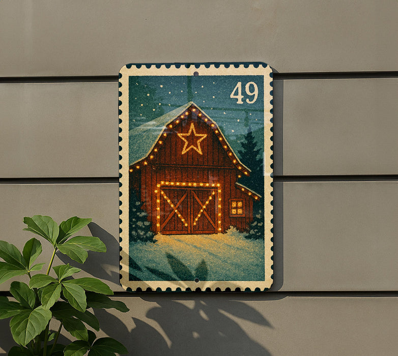 A wooden barn with a star decoration is depicted on a postage stamp, which is affixed to a wall.