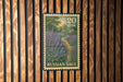 A postage stamp from the United States featuring a painting of a field of purple flowers, with the text "Russian Sage" printed on it.