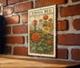 A vintage-style metal sign with a floral illustration is mounted on a brick wall.