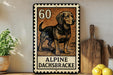 A metal sign with a dog illustration and the text "ALPINE DACHSBRACKE" is displayed on a wooden shelf, accompanied by a potted plant, a wooden cutting board, and some lemons.