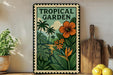 A framed poster of a tropical garden with palm trees, flowers, and lush foliage hangs on a wall, accompanied by a wooden cutting board and a potted plant.