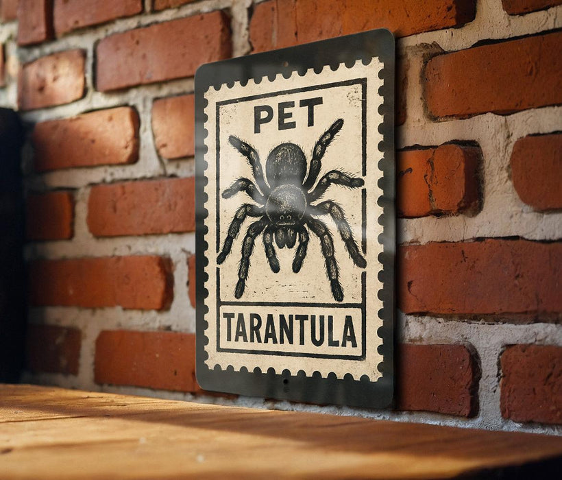 A metal sign with a black and white illustration of a tarantula, mounted on a brick wall.