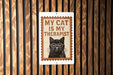 A sign with the text "MY CAT IS MY THERAPIST" and an illustration of a cat wearing glasses.