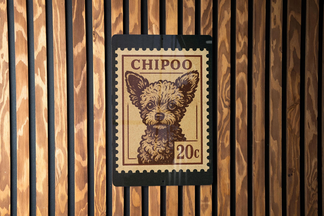 A small, brown dog is depicted on a 20 cent postage stamp, which is affixed to a wooden wall.