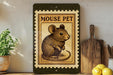 a framed illustration of a mouse on a shelf, with a potted plant to the left and a wooden cutting board to the right.