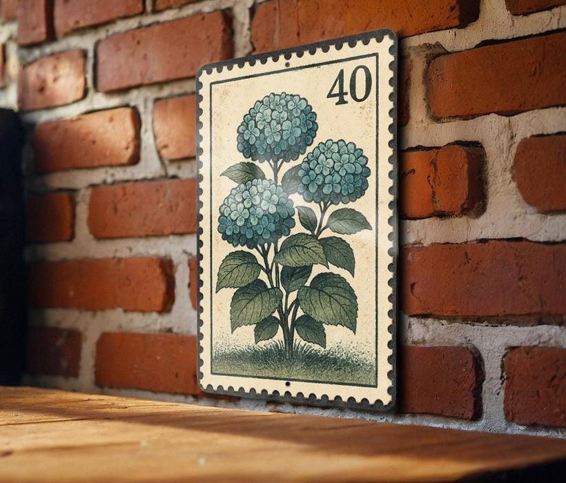 A vintage-style stamp depicting a blue hydrangea flower is mounted on a brick wall.