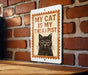 A sign with the text "MY CAT IS MY THERAPIST" and an illustration of a cat wearing glasses.