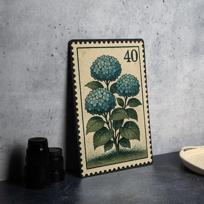 A framed illustration of a blue hydrangea plant on a wall, with a stamp-like border and the number 40 on it.