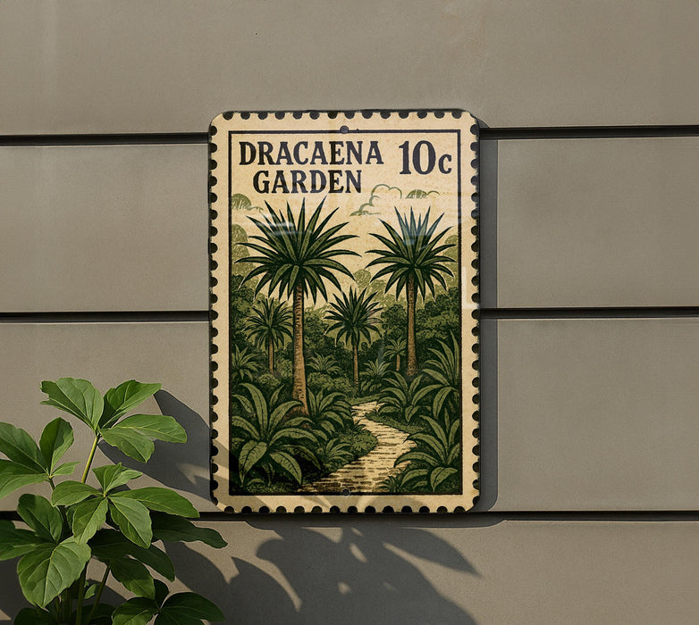 A metal sign with a tropical garden scene, featuring palm trees and a winding path, mounted on a wall.