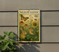 a wildlife garden sign with a rabbit, bird, and flowers, mounted on a wall.