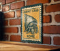 A vintage-style metal sign with a hermit crab illustration and the text "HERMIT CRAB HOME" is displayed on a brick wall.