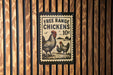 A sign advertising free range chickens for 10 cents is displayed on a wooden wall.