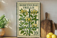 a vintage-style metal sign with a floral design, placed on a wooden shelf next to a wooden cutting board and a potted plant.