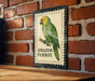 a poster of an Amazon parrot, which is mounted on a brick wall.