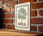 A wooden table with a sign featuring a plant illustration and the word "DILL" on it, mounted on a brick wall.