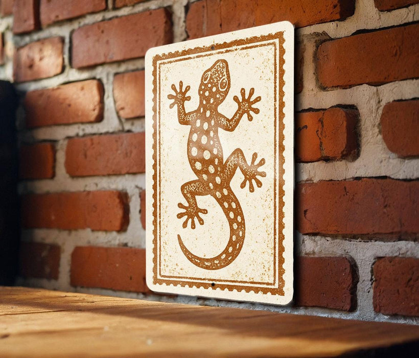 a wooden table with a framed picture of a lizard on it, mounted on a brick wall.
