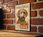 A metal sign featuring a dog's face on a brick wall, with the text "WHOODLE 29 USA" printed on it.