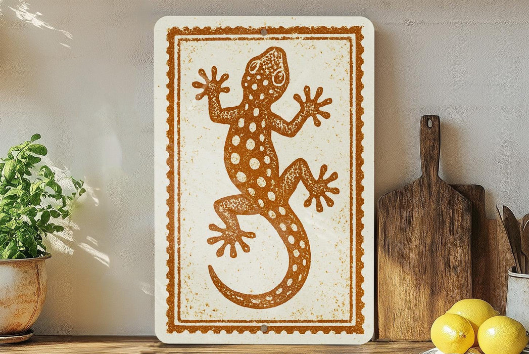 a decorative sign with a lizard design, placed on a shelf next to a wooden cutting board and some lemons.