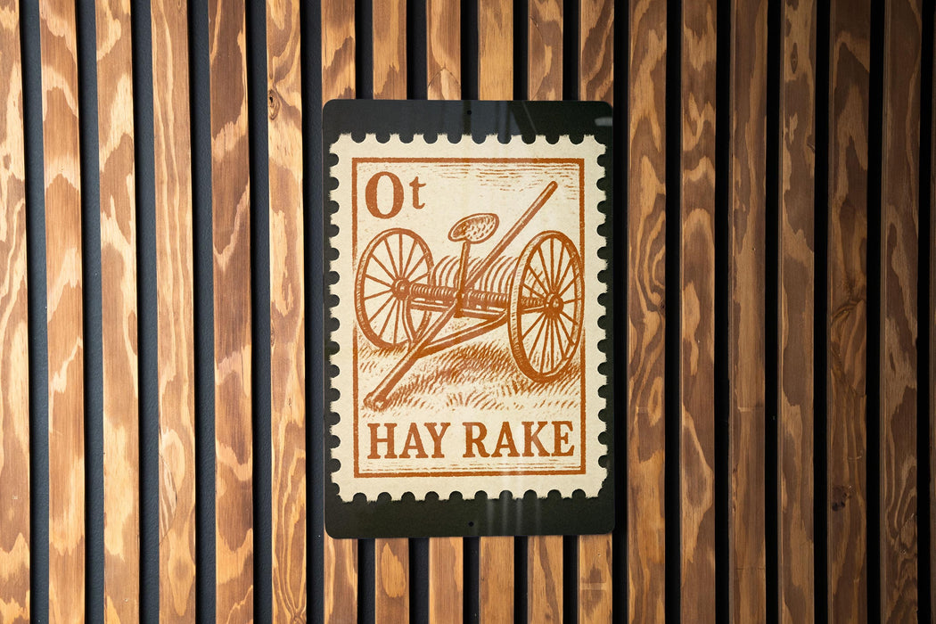 a sign with the text "Ot Hay Rake" on it, which is mounted on a wooden wall.